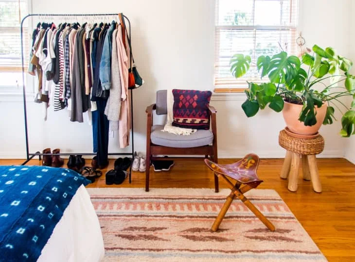 garment rack in small bedroom