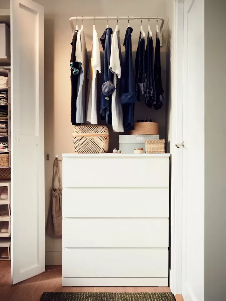 diy closet with clothing rack over dresser