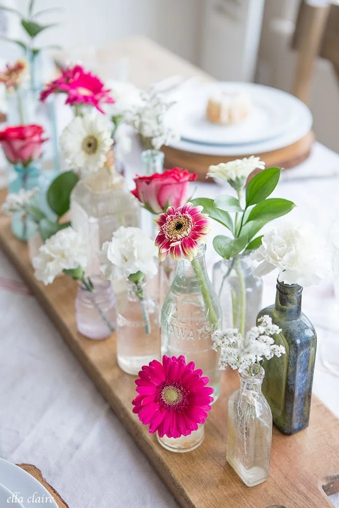 vintage bottles and flowers Valentines Day Table Decorations