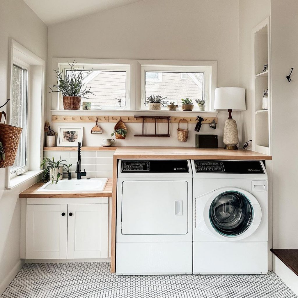 small laundry room with large window