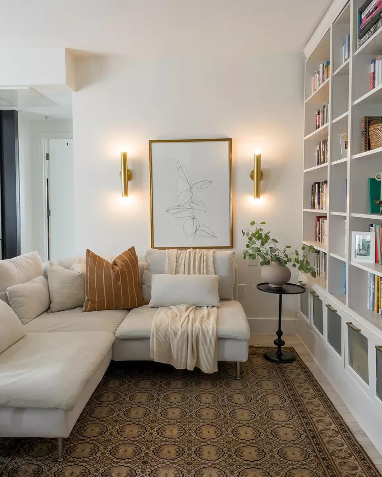 small living room furniture and artwork enhanced by good lighting.