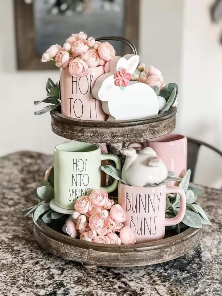 Easter mugs displayed with mini roses and rabbit figurines, perfect Easter decorations for the home