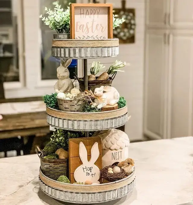 Rustic tiered tray filled with Easter decorations, featuring wooden accents, eggs, and greenery, perfect for a farmhouse-inspired Easter home decor
