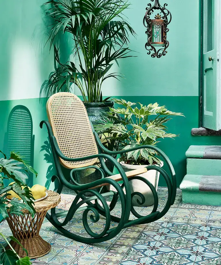 green porch with repainted rocking chair